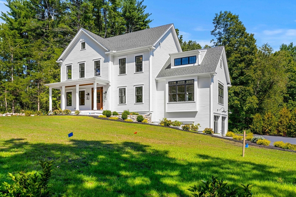1 Elm Street Middleton, MA 01949 - Photo 1 of 42 a front view of a house with swimming pool