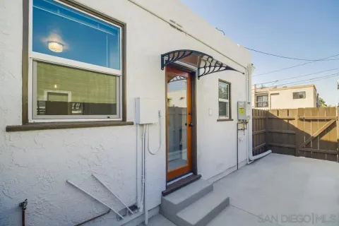 a kitchen that has a sink stainless steel appliances and cabinets