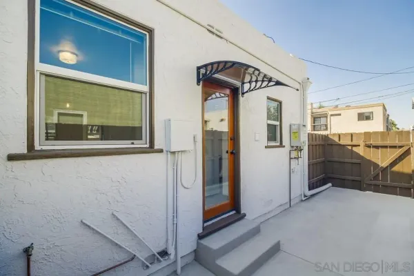a kitchen that has a sink stainless steel appliances and cabinets