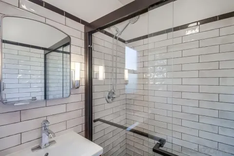 a kitchen with granite countertop cabinets stainless steel appliances and a window