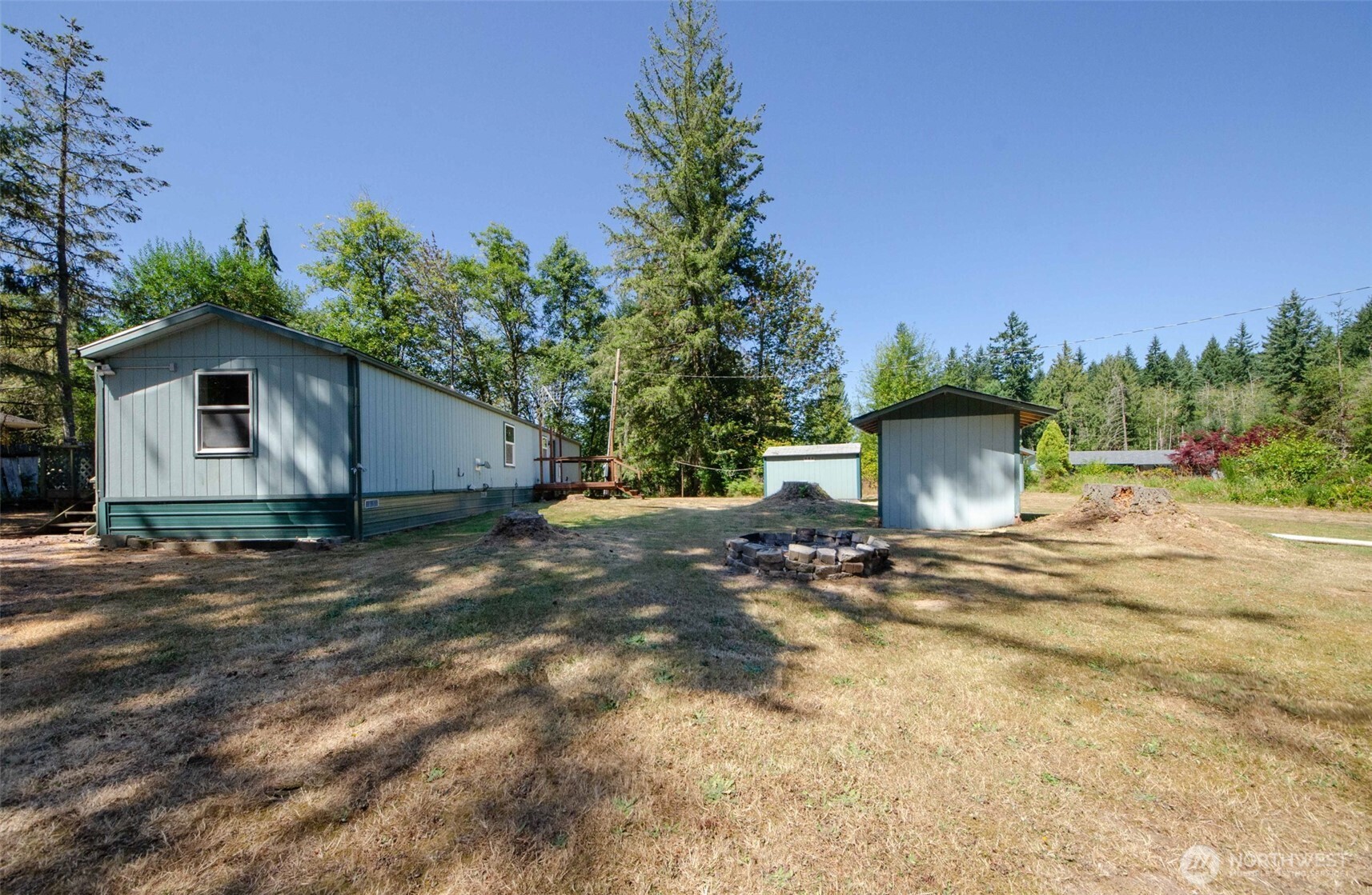 1487 Centralia Alpha Road Chehalis, WA 98532 - Photo 18 of 36 a view of a house with backyard and trees