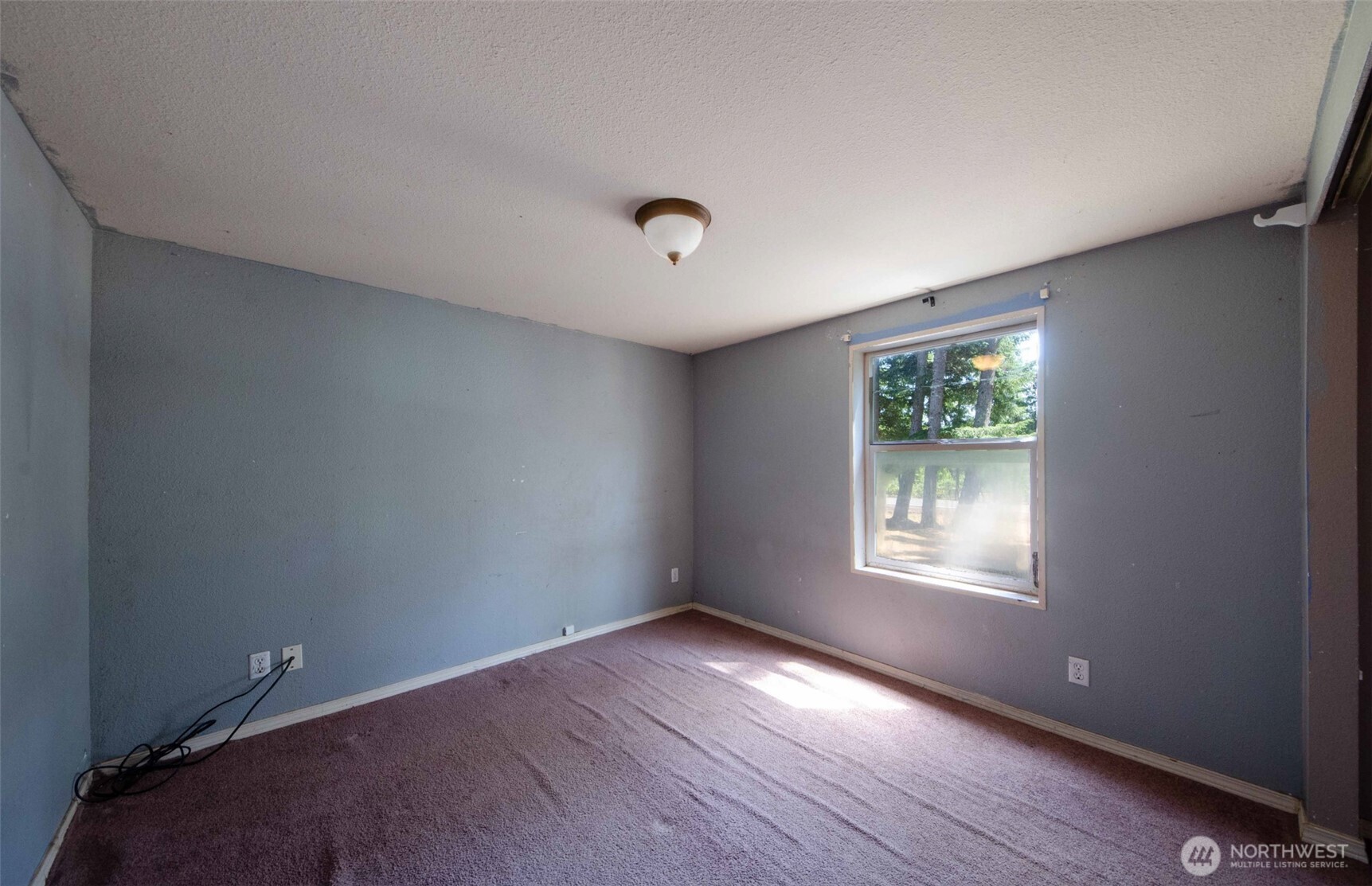 1487 Centralia Alpha Road Chehalis, WA 98532 - Photo 23 of 36 an empty room with wooden floor and windows