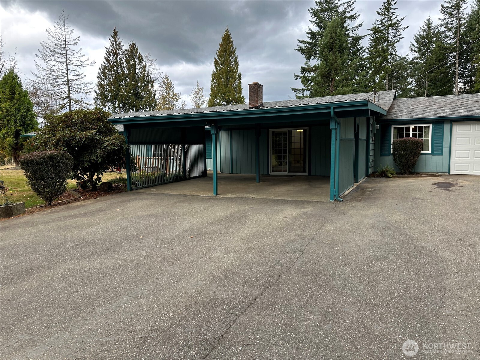 1487 Centralia Alpha Road Chehalis, WA 98532 - Photo 32 of 36 a view of a house with a outdoor space and trees