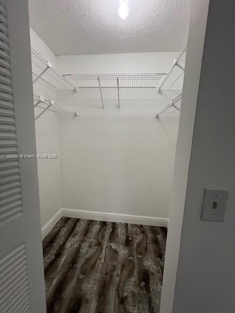 18336 Northwest 68th Avenue, Unit L Hialeah, FL 33015 - Photo 13 of 14 a view of a room with racks on the wall