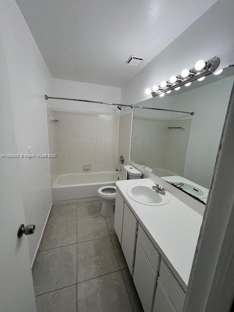 18336 Northwest 68th Avenue, Unit L Hialeah, FL 33015 - Photo 14 of 14 a bathroom with a sink a toilet a mirror and shower