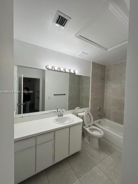 18336 Northwest 68th Avenue, Unit L Hialeah, FL 33015 - Photo 7 of 14 a bathroom with a double vanity sink toilet mirror and bathtub