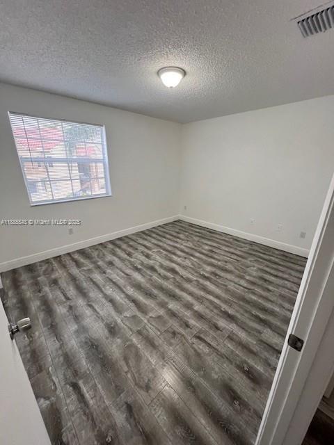 18336 Northwest 68th Avenue, Unit L Hialeah, FL 33015 - Photo 9 of 14 a view of an empty room