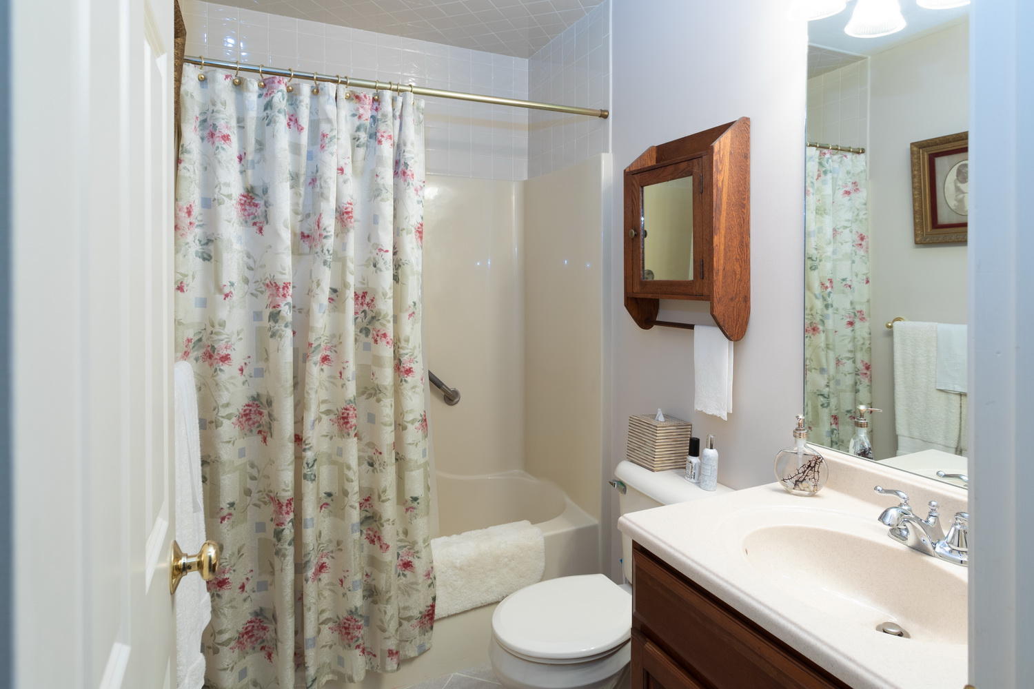 178 Winding Cove Road Marstons Mills, MA 02648 - Photo 15 of 17 a bathroom with a sink a toilet and shower curtain