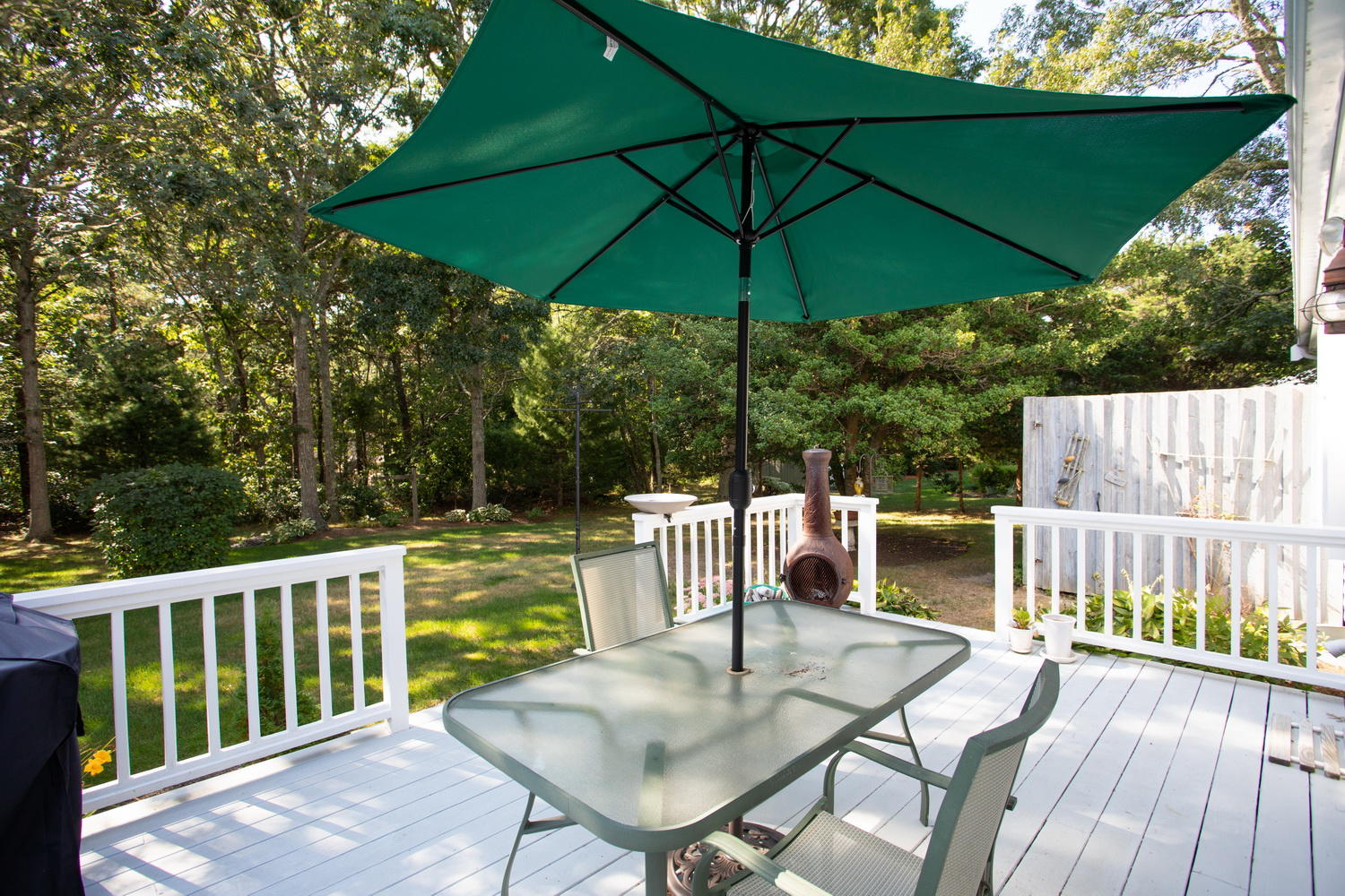 178 Winding Cove Road Marstons Mills, MA 02648 - Photo 5 of 17 a view of balcony with outdoor seating and wooden floor