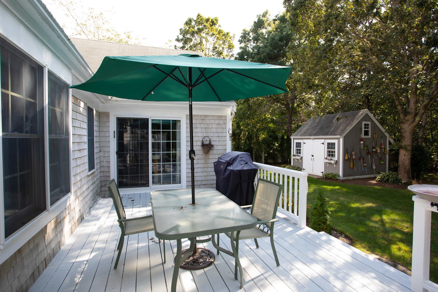 178 Winding Cove Road Marstons Mills, MA 02648 - Photo 6 of 17 a view of house with a yard and furniture