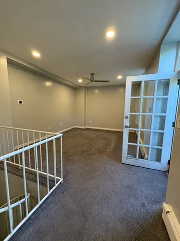 a view of kitchen with stainless steel appliances cabinets