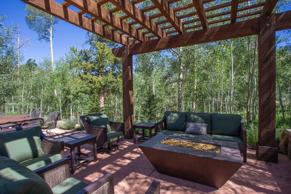 1680 Golden Eagle Road Silverthorne, CO 80498 - Photo 27 of 40 a outdoor living space with furniture and garden view