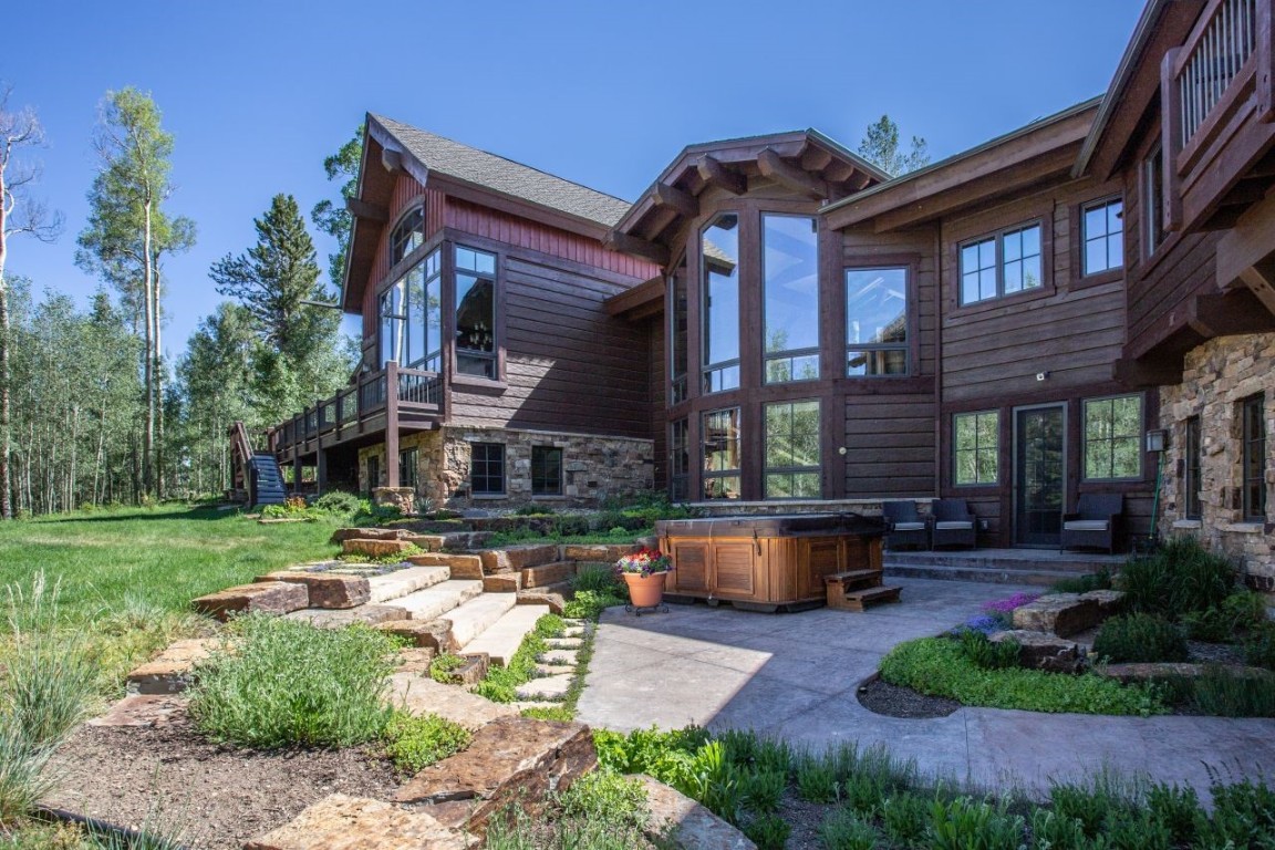 1680 Golden Eagle Road Silverthorne, CO 80498 - Photo 30 of 40 a front view of a house with swimming pool having outdoor seating