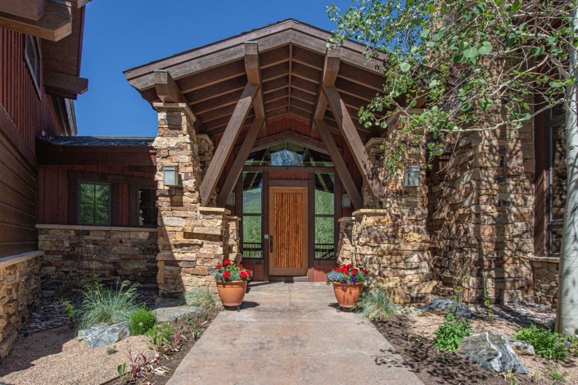 1680 Golden Eagle Road Silverthorne, CO 80498 - Photo 3 of 40 a view of a wooden door of the house
