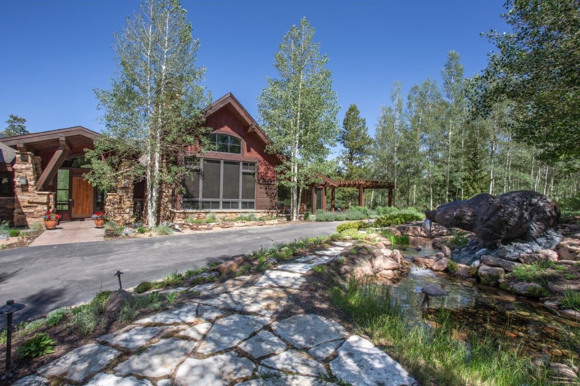 1680 Golden Eagle Road Silverthorne, CO 80498 - Photo 35 of 40 a front view of a house with a yard