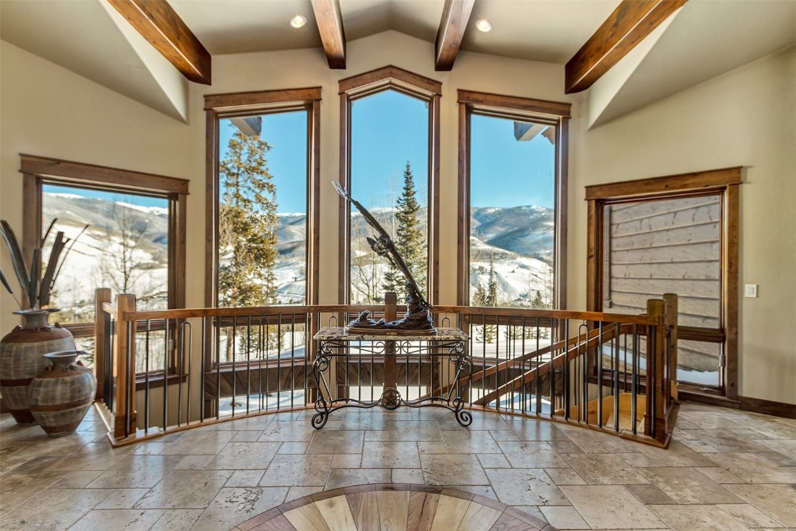 1680 Golden Eagle Road Silverthorne, CO 80498 - Photo 4 of 40 a dining room with furniture and large windows