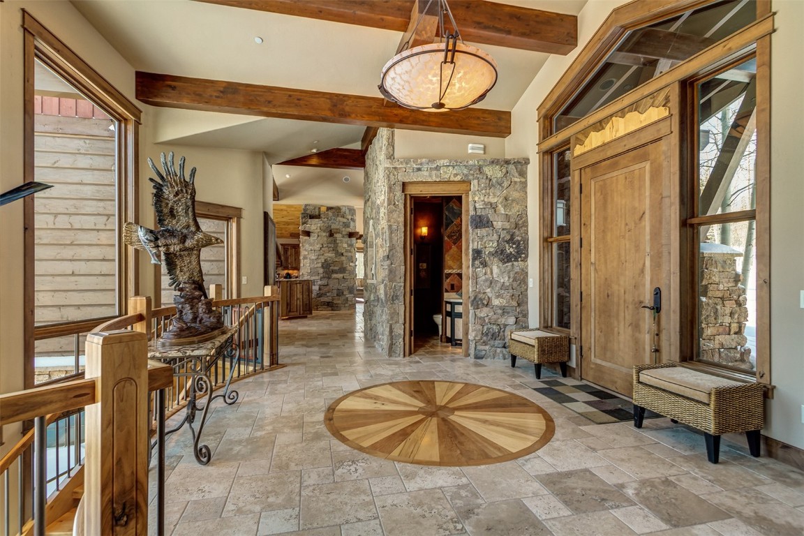 1680 Golden Eagle Road Silverthorne, CO 80498 - Photo 5 of 40 a room with lots of windows and mirrors