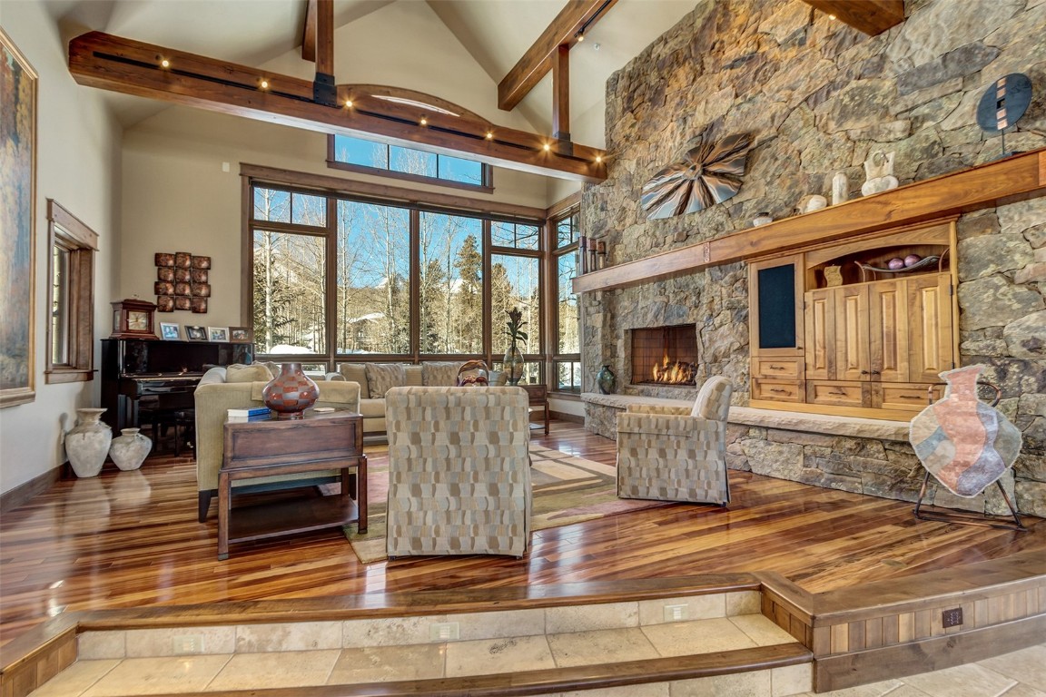 1680 Golden Eagle Road Silverthorne, CO 80498 - Photo 7 of 40 a living room with furniture and a fireplace