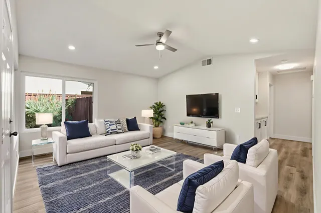 a living room with furniture and a large window