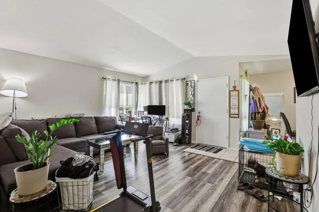 a view of front door with furniture and a window