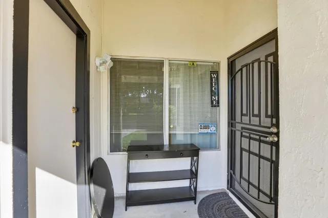 a view of front door and bedroom