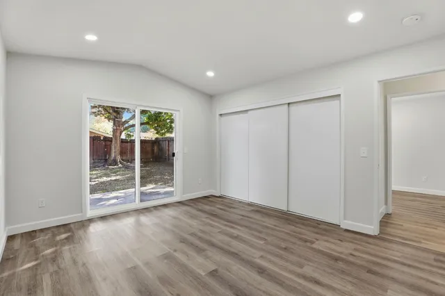 a view of a backyard with table and chairs and a fire pit