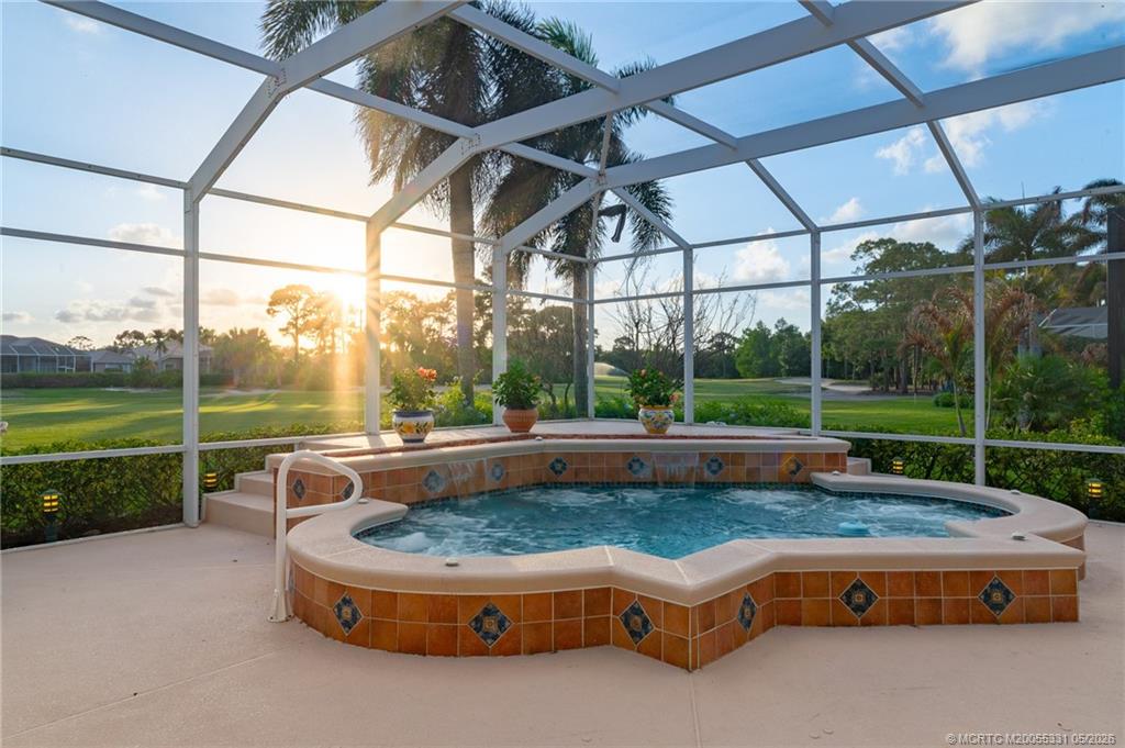 2216 Southeast Stonehaven Road Port St. Lucie, FL 34952 - Photo 28 of 67 a swimming pool with outdoor seating outdoor seating and yard