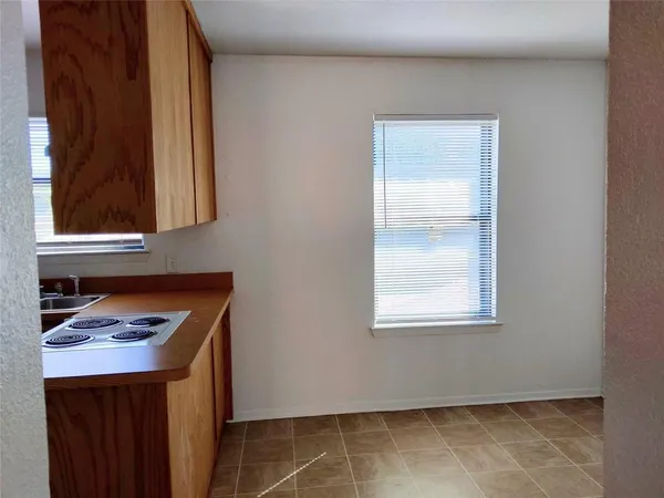 a room that has a window and a table in it