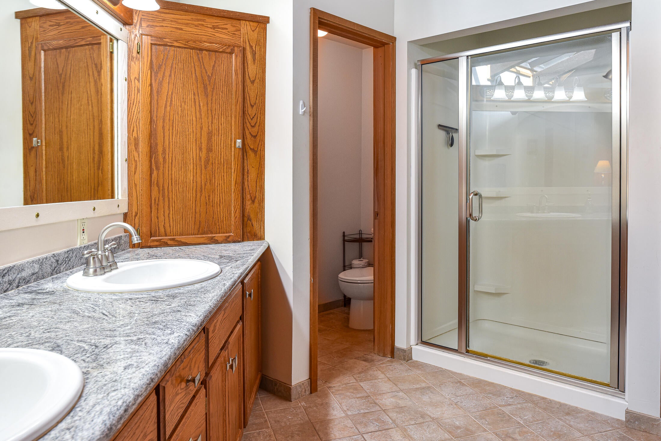 87997 Running Springs Drive Springfield, OR 97478 - Photo 22 of 48 Primary bathroom with double vanity and separate toilet room