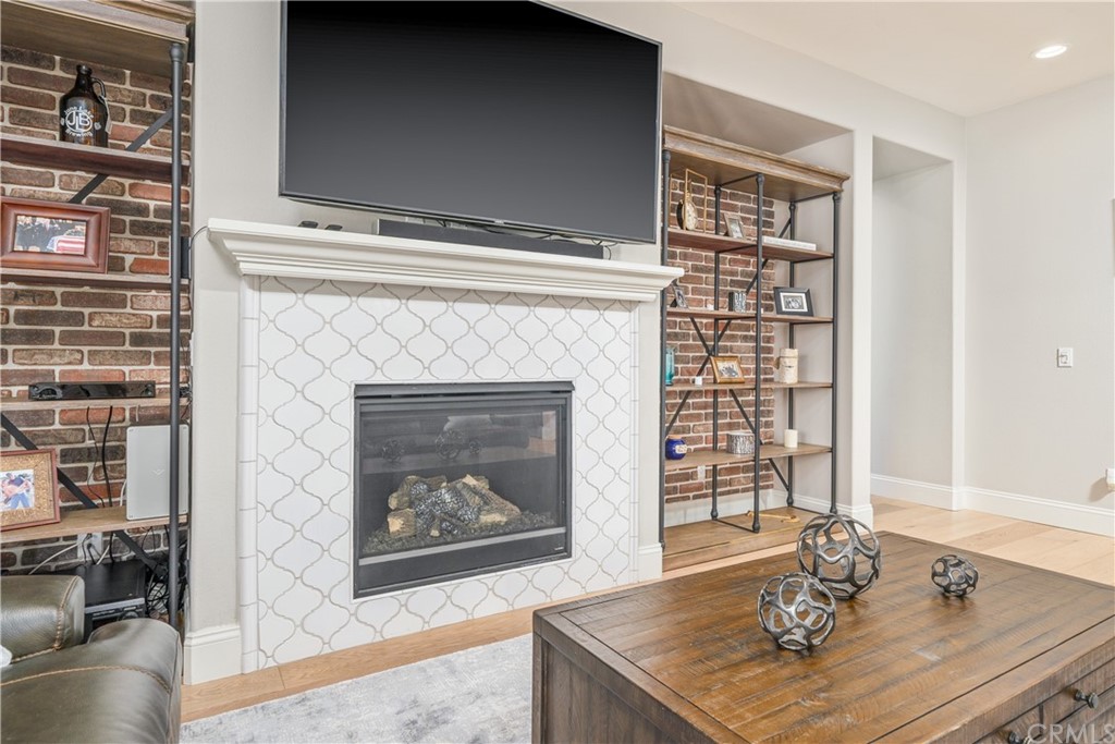 17841 Grapevine Lane San Bernardino, CA 92407 - Photo 13 of 53 a living room with furniture and a fireplace