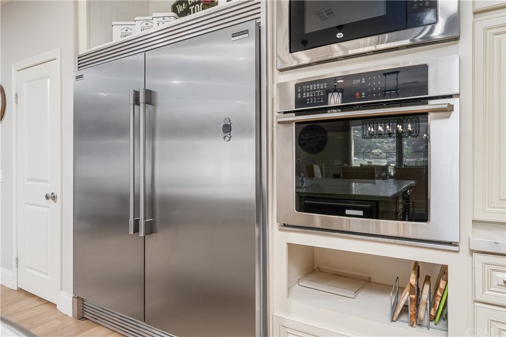 17841 Grapevine Lane San Bernardino, CA 92407 - Photo 17 of 53 a kitchen with a refrigerator and a stove