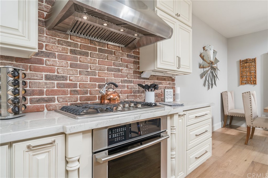 17841 Grapevine Lane San Bernardino, CA 92407 - Photo 18 of 53 a kitchen with stainless steel appliances a sink a stove and cabinets