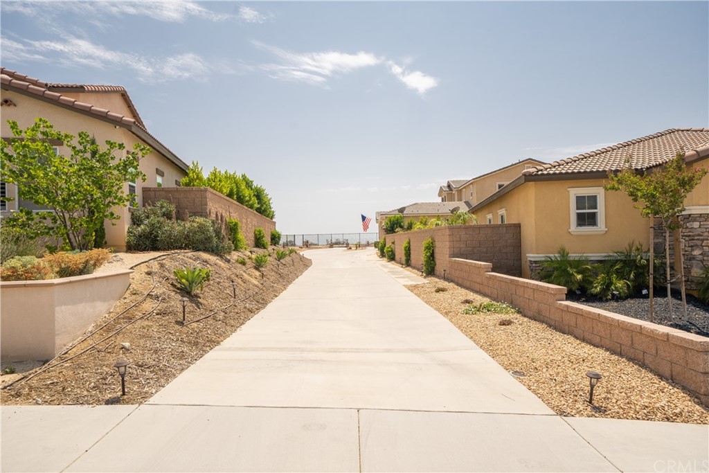 17841 Grapevine Lane San Bernardino, CA 92407 - Photo 2 of 53 a view of a white house with a yard