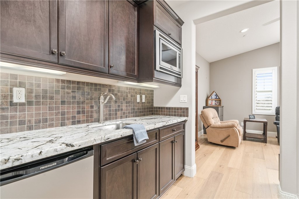 17841 Grapevine Lane San Bernardino, CA 92407 - Photo 23 of 53 a kitchen with granite countertop a sink and cabinets