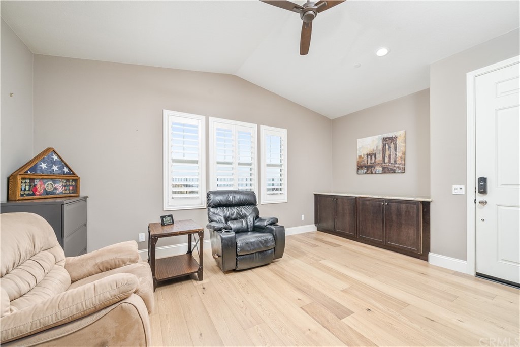 17841 Grapevine Lane San Bernardino, CA 92407 - Photo 24 of 53 a living room with furniture and a flat screen tv