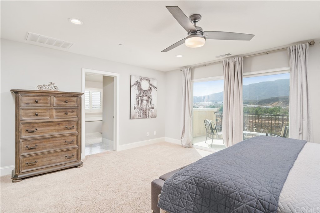 17841 Grapevine Lane San Bernardino, CA 92407 - Photo 33 of 53 a spacious bedroom with a bed and a large window