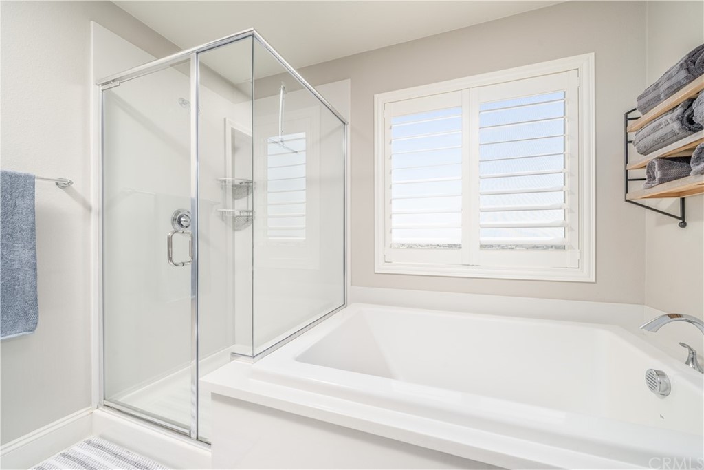 17841 Grapevine Lane San Bernardino, CA 92407 - Photo 36 of 53 a bathroom with a bathtub and a shower