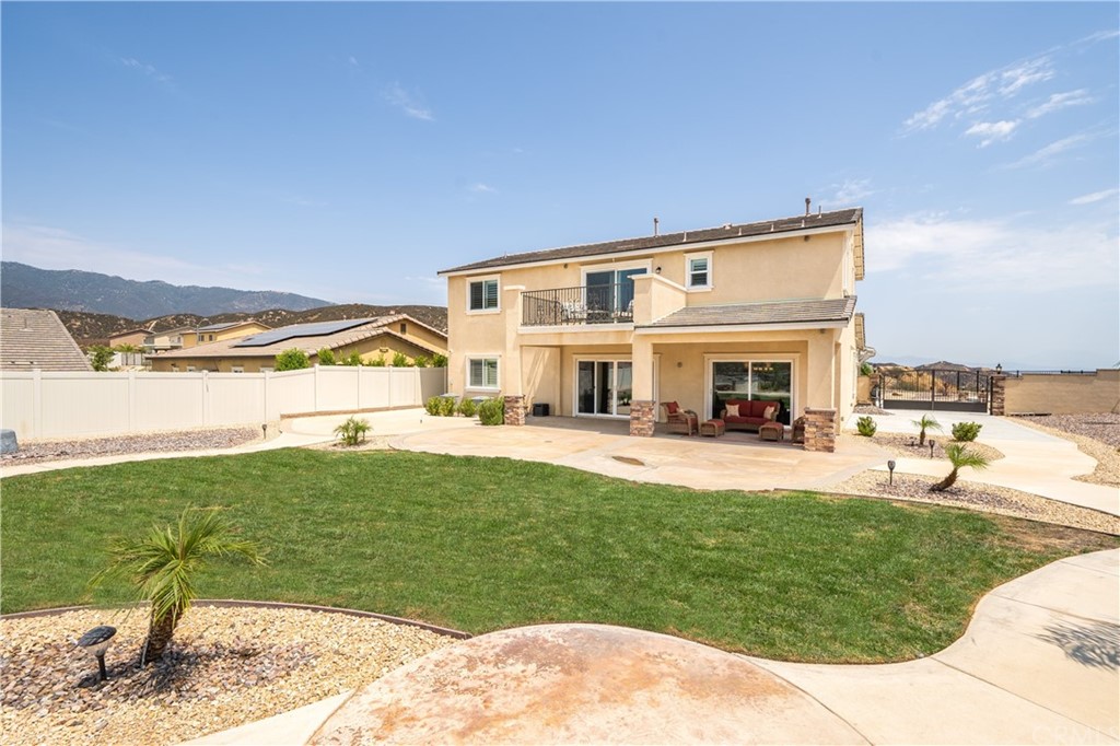 17841 Grapevine Lane San Bernardino, CA 92407 - Photo 43 of 53 a front view of a house with garden