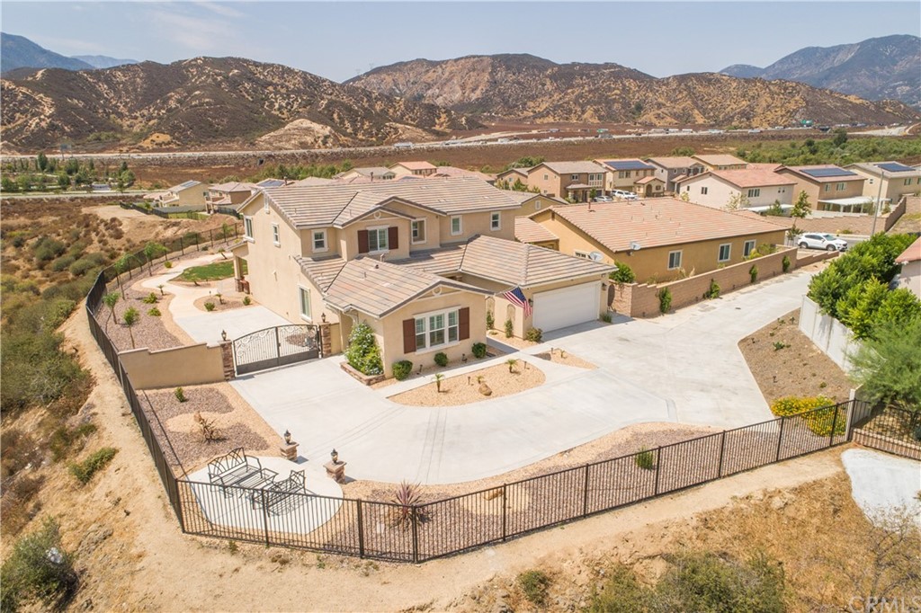 17841 Grapevine Lane San Bernardino, CA 92407 - Photo 46 of 53 an aerial view of residential houses with outdoor space