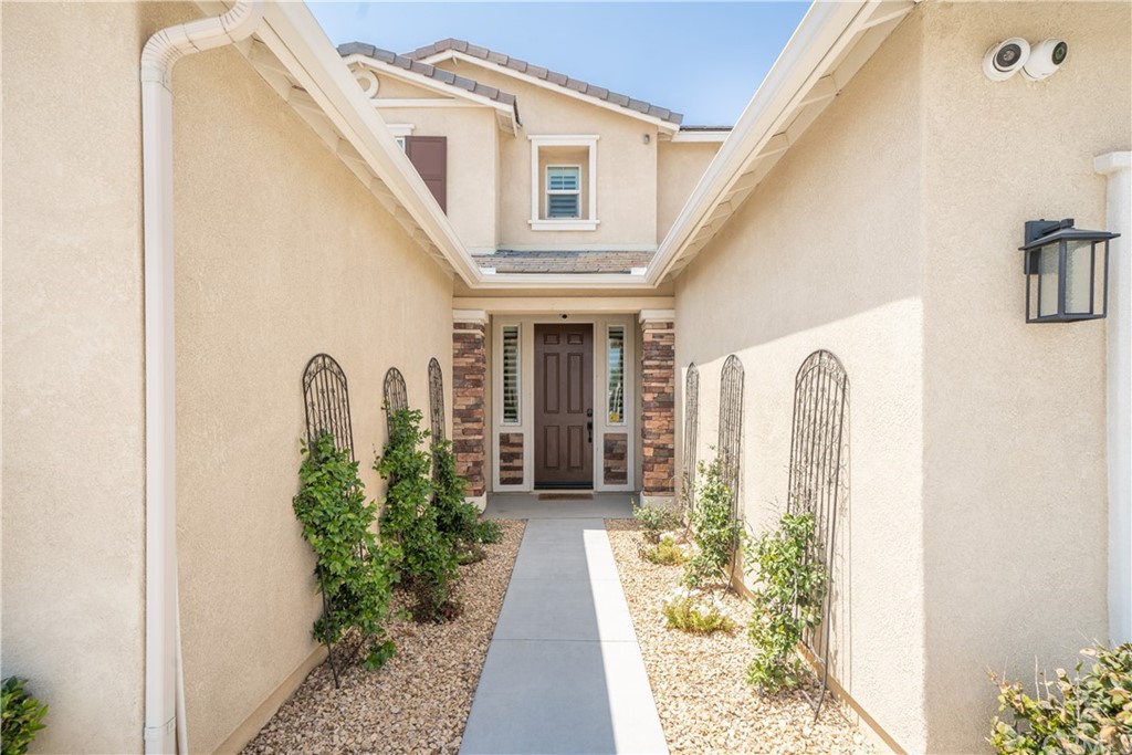 17841 Grapevine Lane San Bernardino, CA 92407 - Photo 9 of 53 a front view of a house with garden