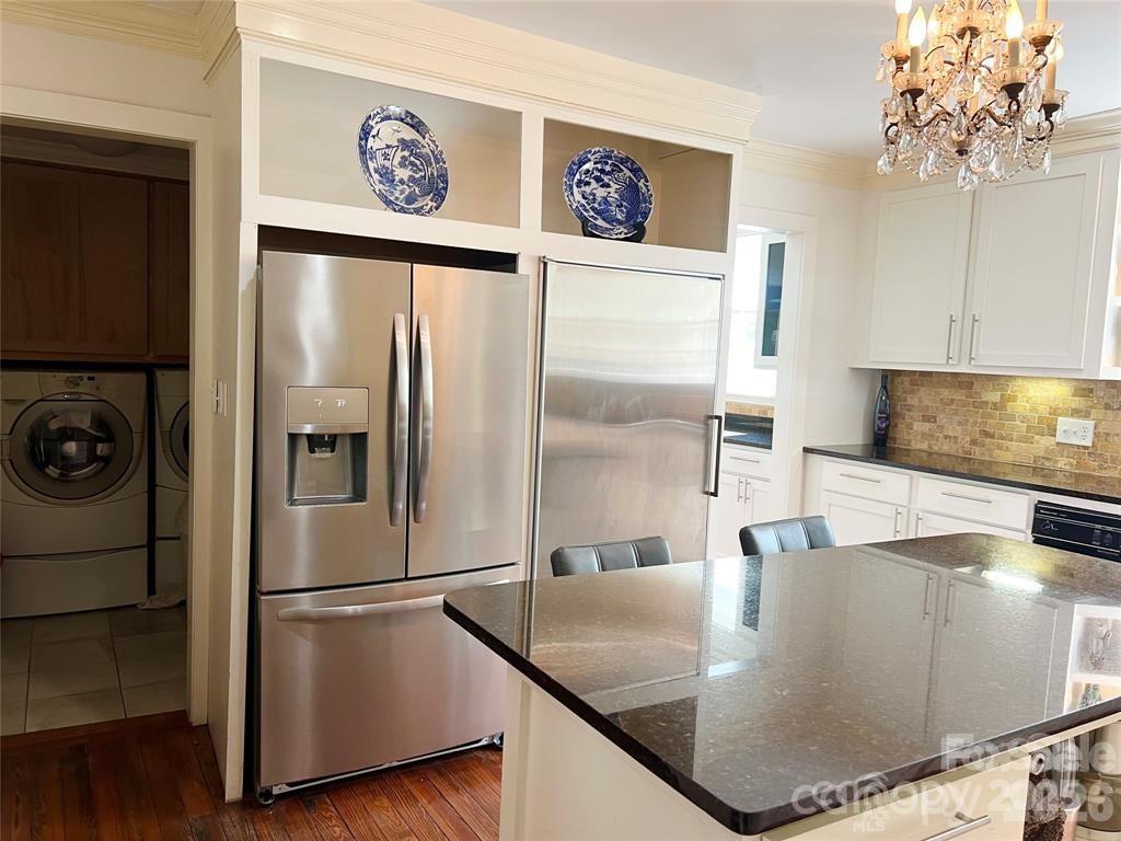 530 East Rutledge Avenue Gaffney, SC 29340 - Photo 18 of 47 a kitchen with stainless steel appliances granite countertop a refrigerator a stove and a sink with wooden floor