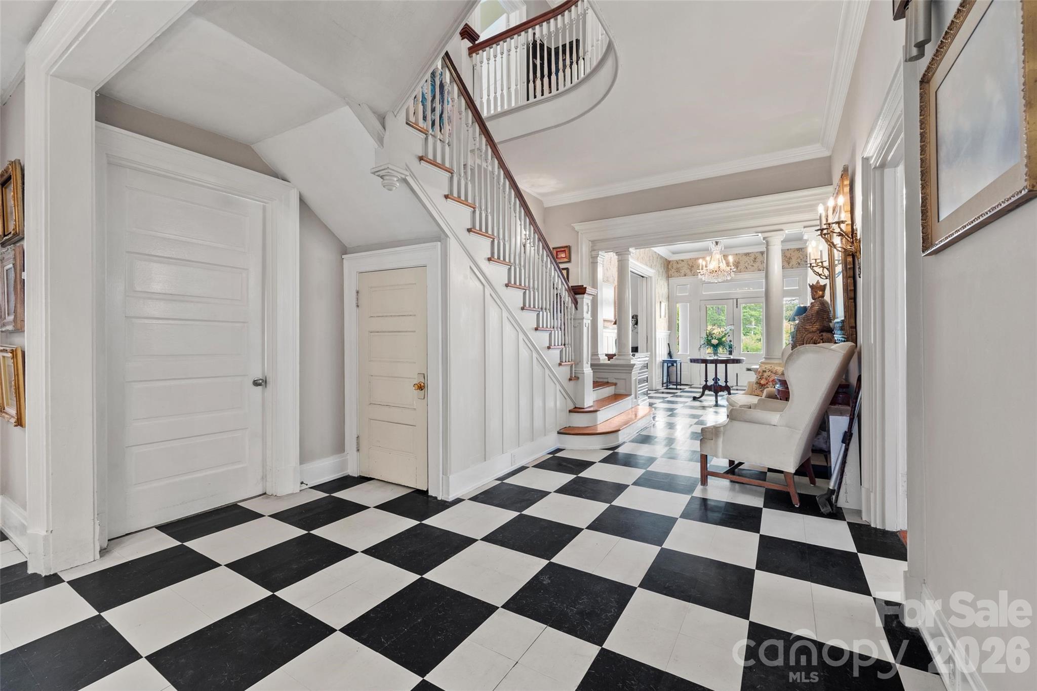 530 East Rutledge Avenue Gaffney, SC 29340 - Photo 19 of 47 a room with a black white checkered floor with a gaming machine and a rug