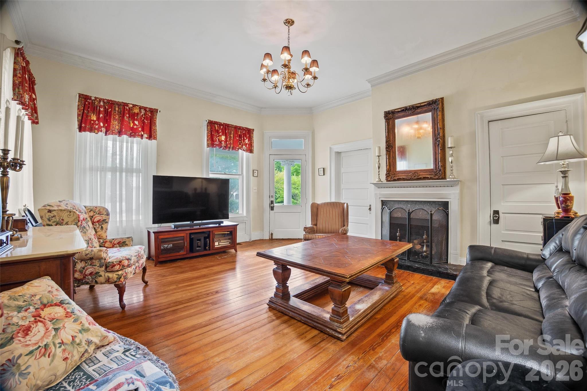 530 East Rutledge Avenue Gaffney, SC 29340 - Photo 21 of 47 a living room with furniture a flat screen tv and a fireplace
