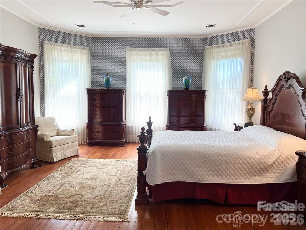 530 East Rutledge Avenue Gaffney, SC 29340 - Photo 32 of 47 a bedroom with a bed and wooden floor