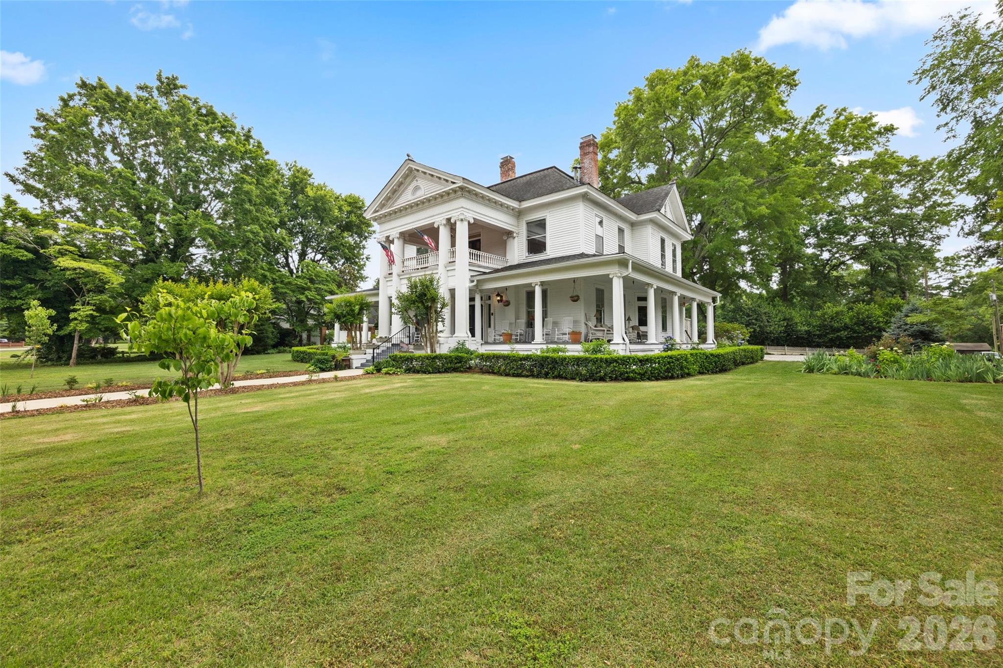 530 East Rutledge Avenue Gaffney, SC 29340 - Photo 43 of 47 a front view of a house with a yard table and trees