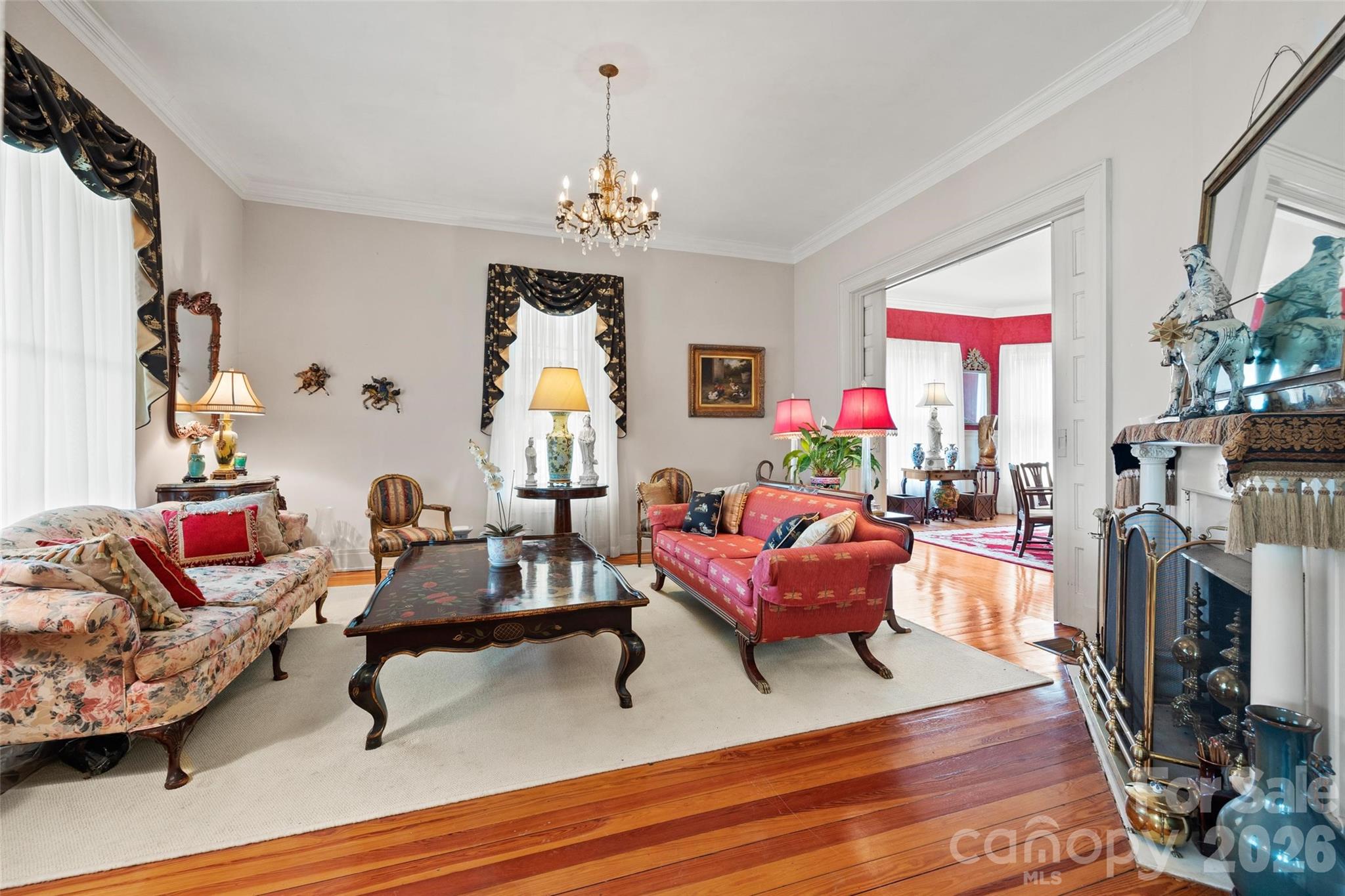 530 East Rutledge Avenue Gaffney, SC 29340 - Photo 10 of 47 a living room with furniture a fireplace and a flat screen tv