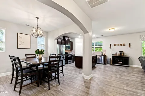 a view of a dining room with furniture window and wooden floor