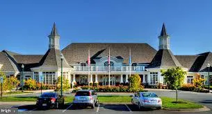 a living room with pool table and a pool table