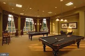 a view of a dining room with lots of tables and chairs