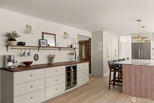 a bedroom with a bed and dresser with mirror